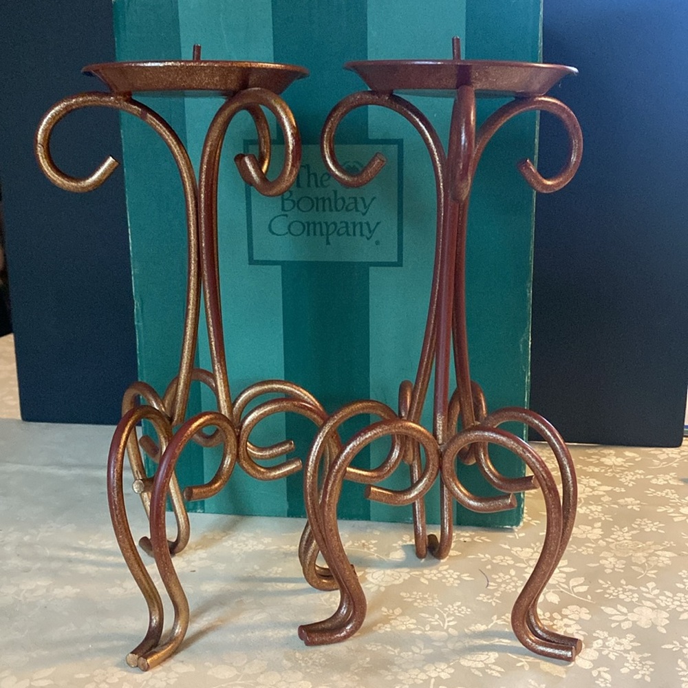 Faux copper finish, metal candlesticks with elegant scroll accents